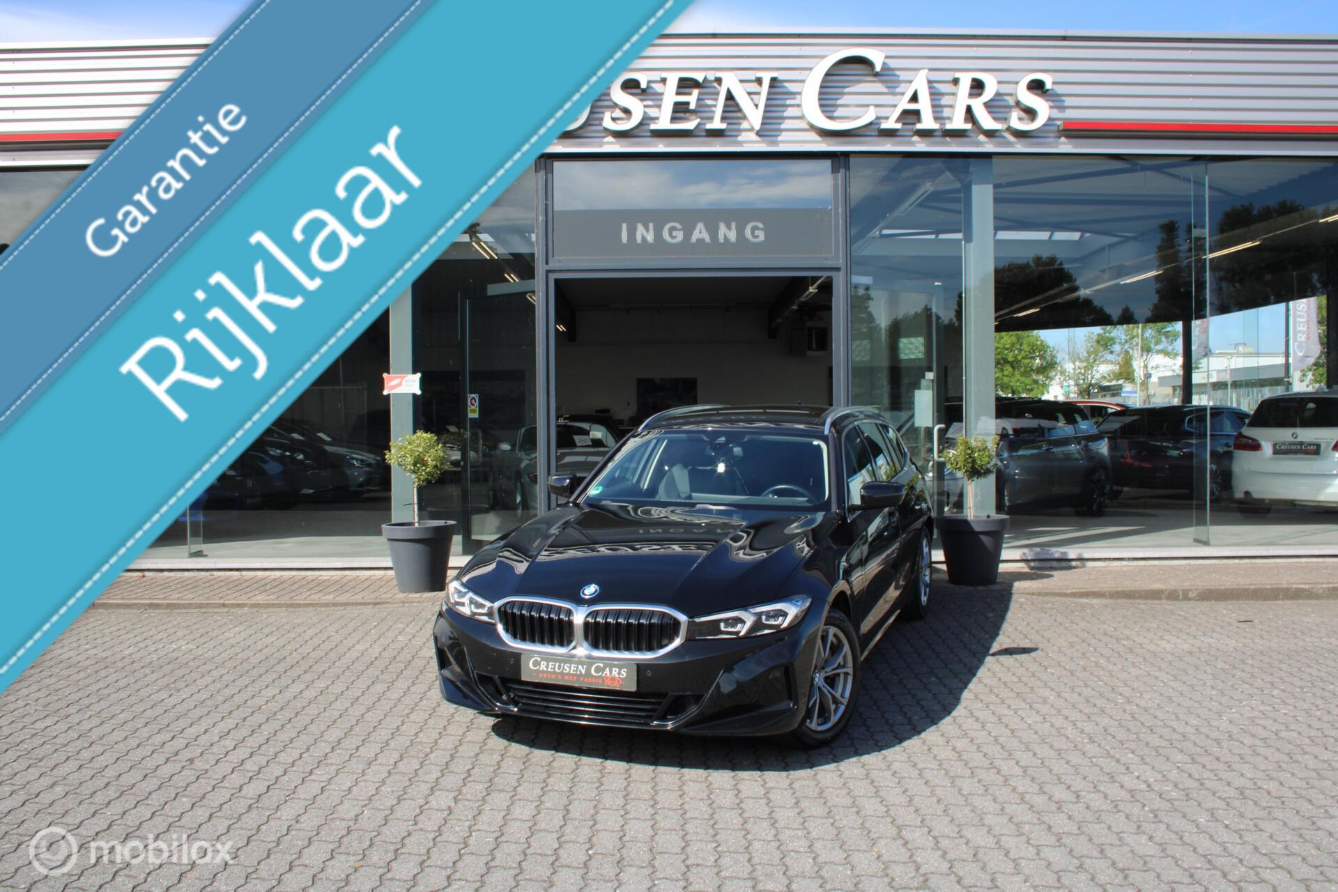 BMW 3-serie Touring 320e xDrive/Led/Trekhaak/Navi/Tel/All seas/ 2024 - voorkant