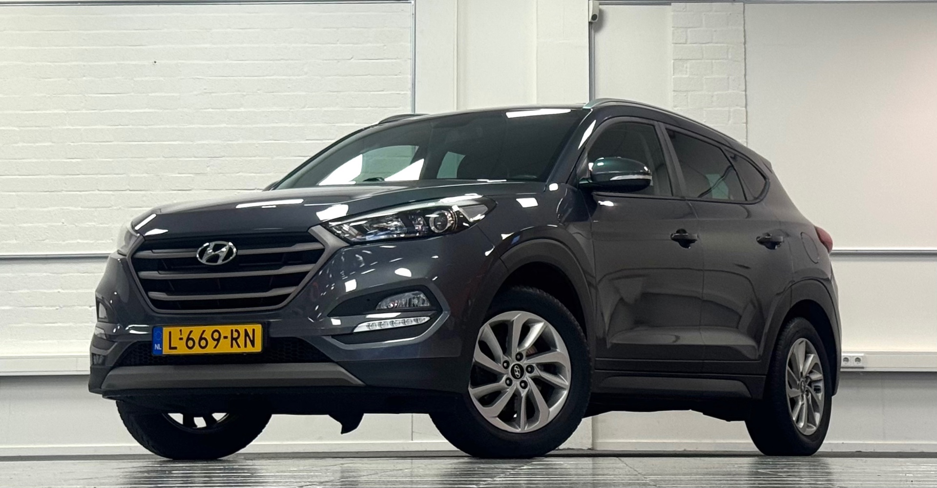 Hyundai Tucson 1.6 GDi i-Motion Trekhaak Navigatie Camera APK13-01-2027 2018 - voorkant