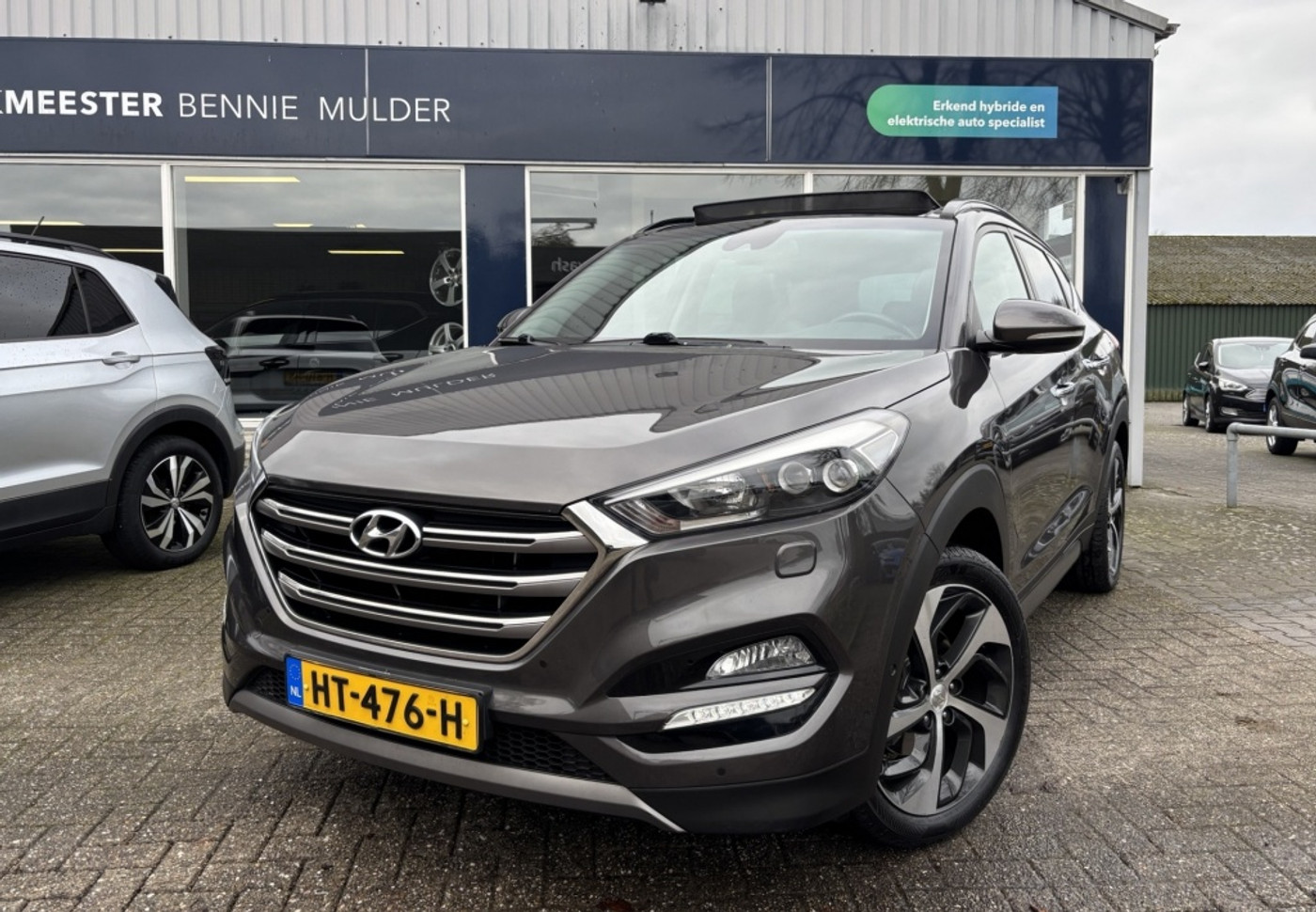 Hyundai Tucson 1.6 T-GDi Premium 4WD / AUT. / SCHUIFDAK / LEDER 2015 - voorkant