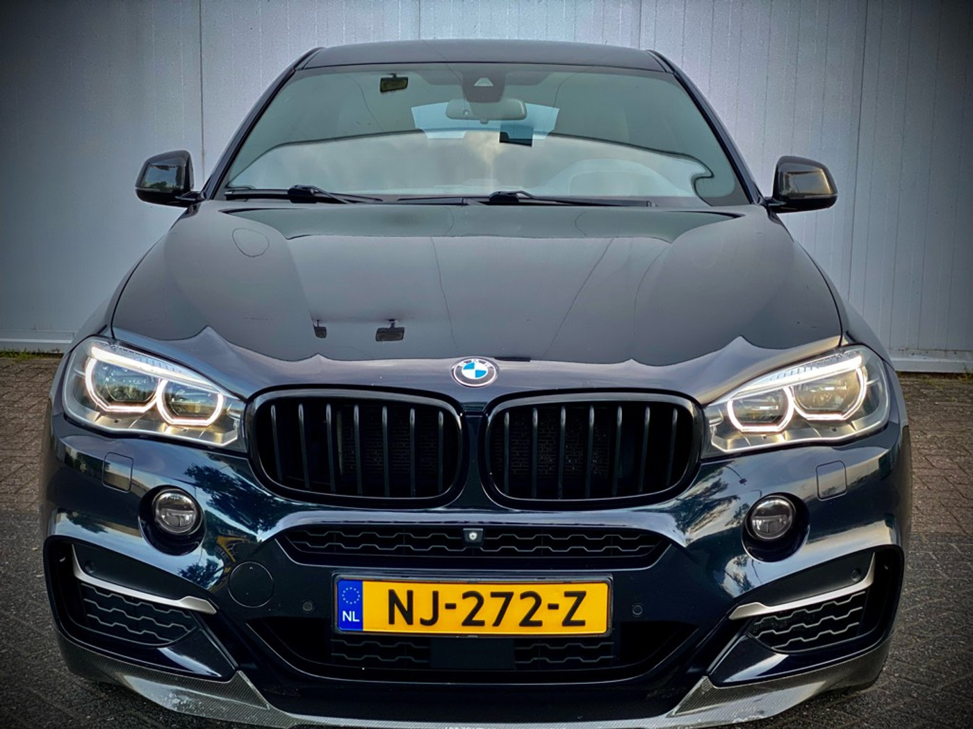 Foto van BMW X6 M50d