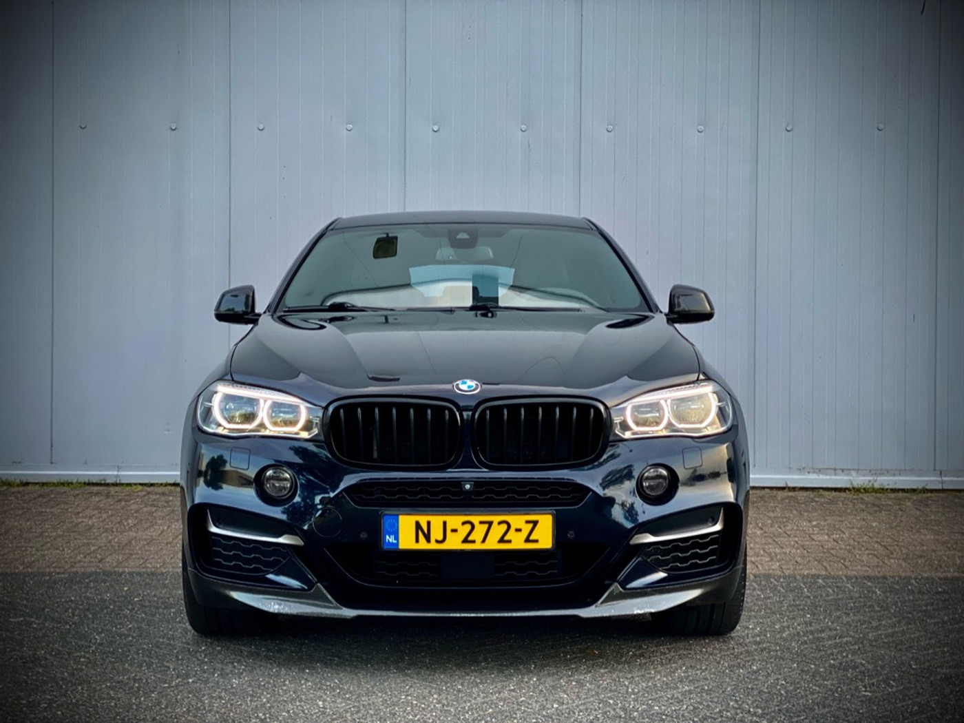Foto van BMW X6 M50d
