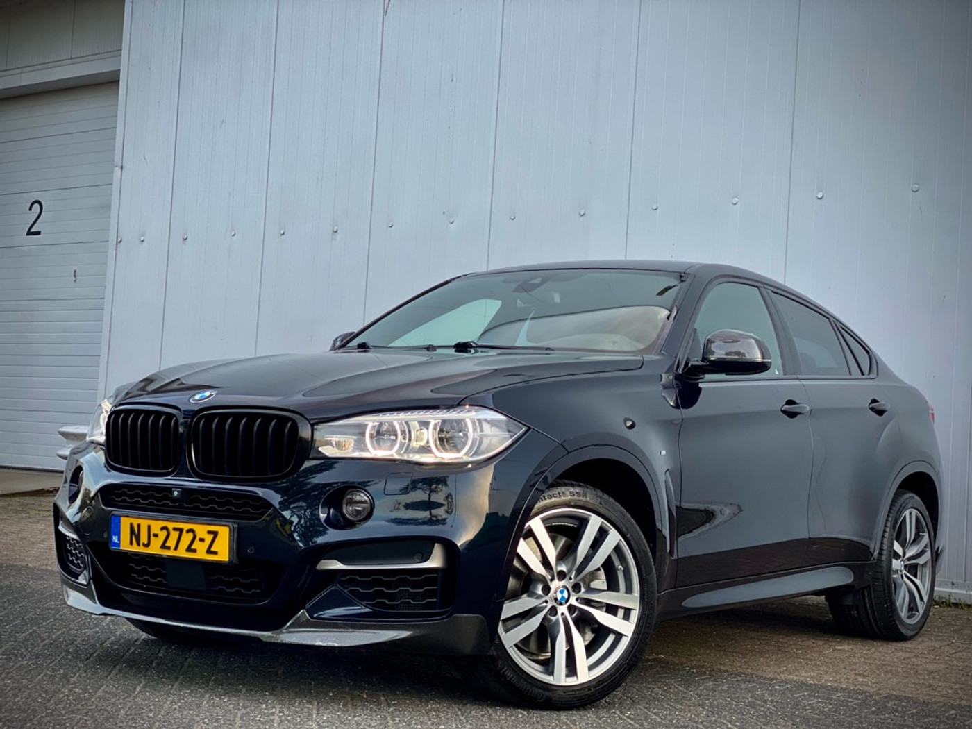Foto van BMW X6 M50d