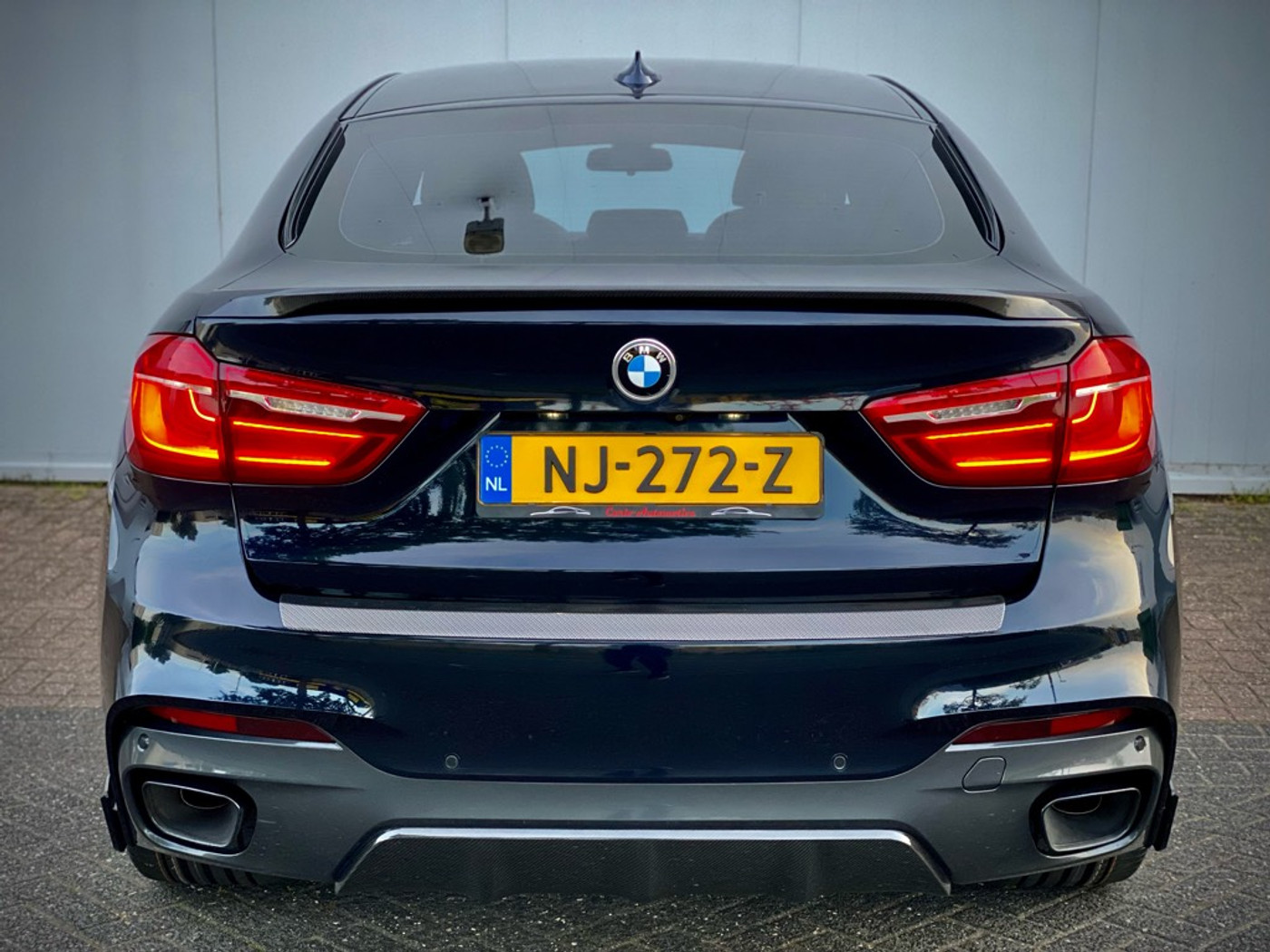Foto van BMW X6 M50d