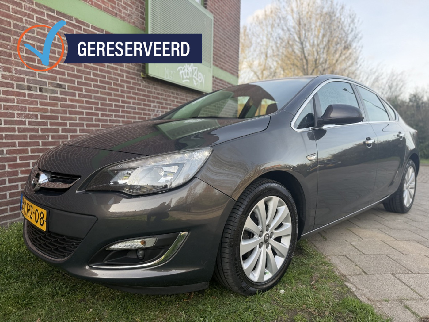 Opel Astra Notchback 1.4 Turbo Cosmo*2013*Clima|Nav|Cruise|Led|Lmv|T-haak 2013 - voorkant