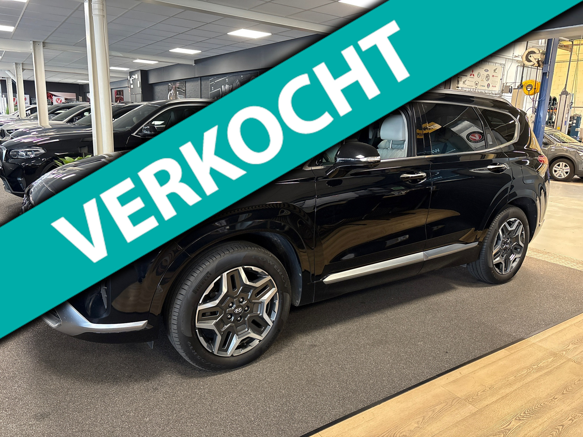 Hyundai Santa Fe 1.6 T-GDI PHEV 4wd Premium 7p SOH100% /navi / leer / Krell audio / head up / stoel koeling 2022 - voorkant