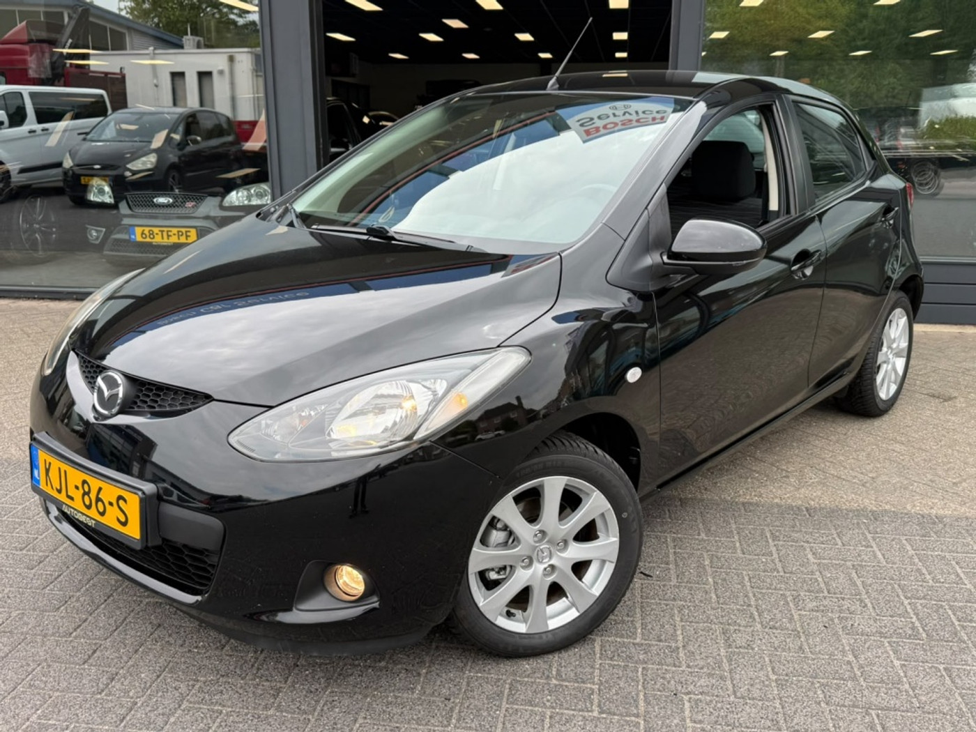 Mazda Mazda 2 1.3hp S-VT Executive Clima 5 deurs. 100% onderhouden!! 2009 - voorkant