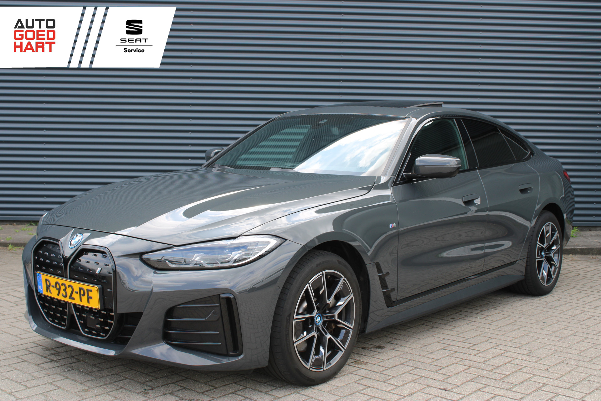 BMW I4 Edrive40 eDrive40 84 kWh M-Sport Dravitgrau Schuif-/kanteldak Leer Harman-Kardon Camera 2022 - voorkant
