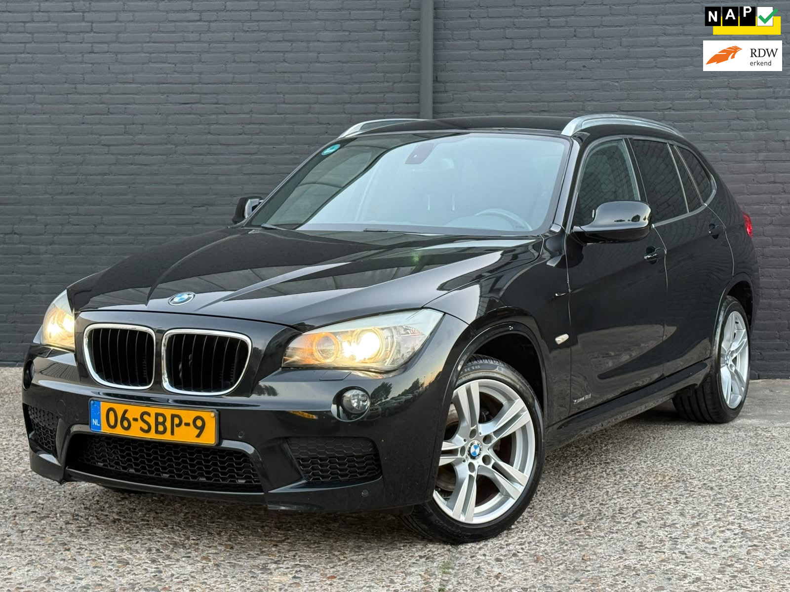 BMW X1 sDrive 18i SDrive18i AIRCO | PDC | TREKHAAK | ELEK RAMEN | NWE APK 2011 - voorkant