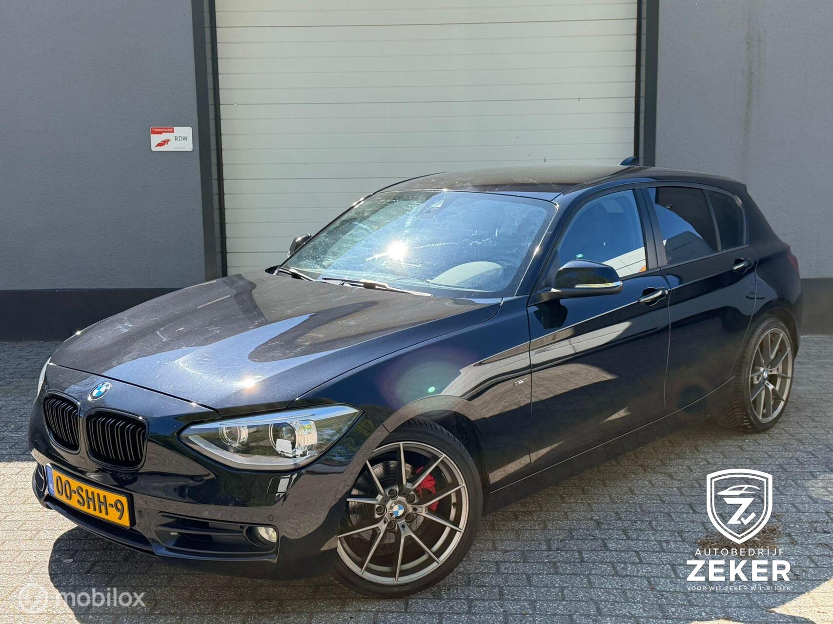 BMW 1er Reihe 118i Sport Line / automaat / nap / navi / cruise 2011 - voorkant