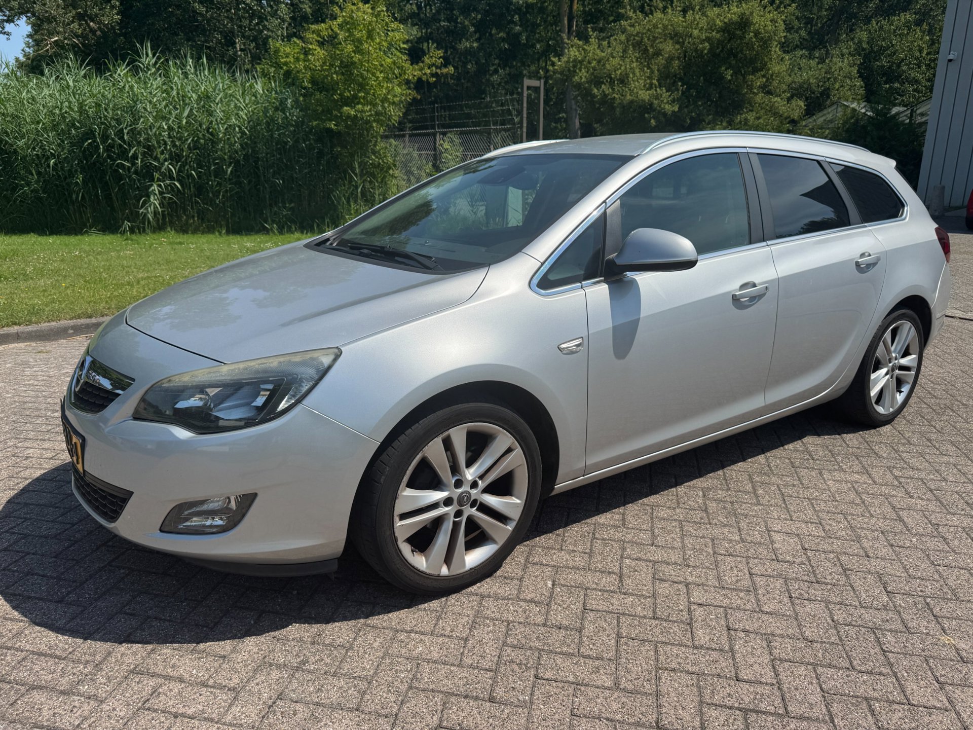 Opel Astra Sports Tourer 1.4 Turbo Sport/AUT/CLIMA/CRUISE/NAVI/ELEK RAMEN V+A/PARKEERSENSOREN/TREKHAAK 2011 - voorkant