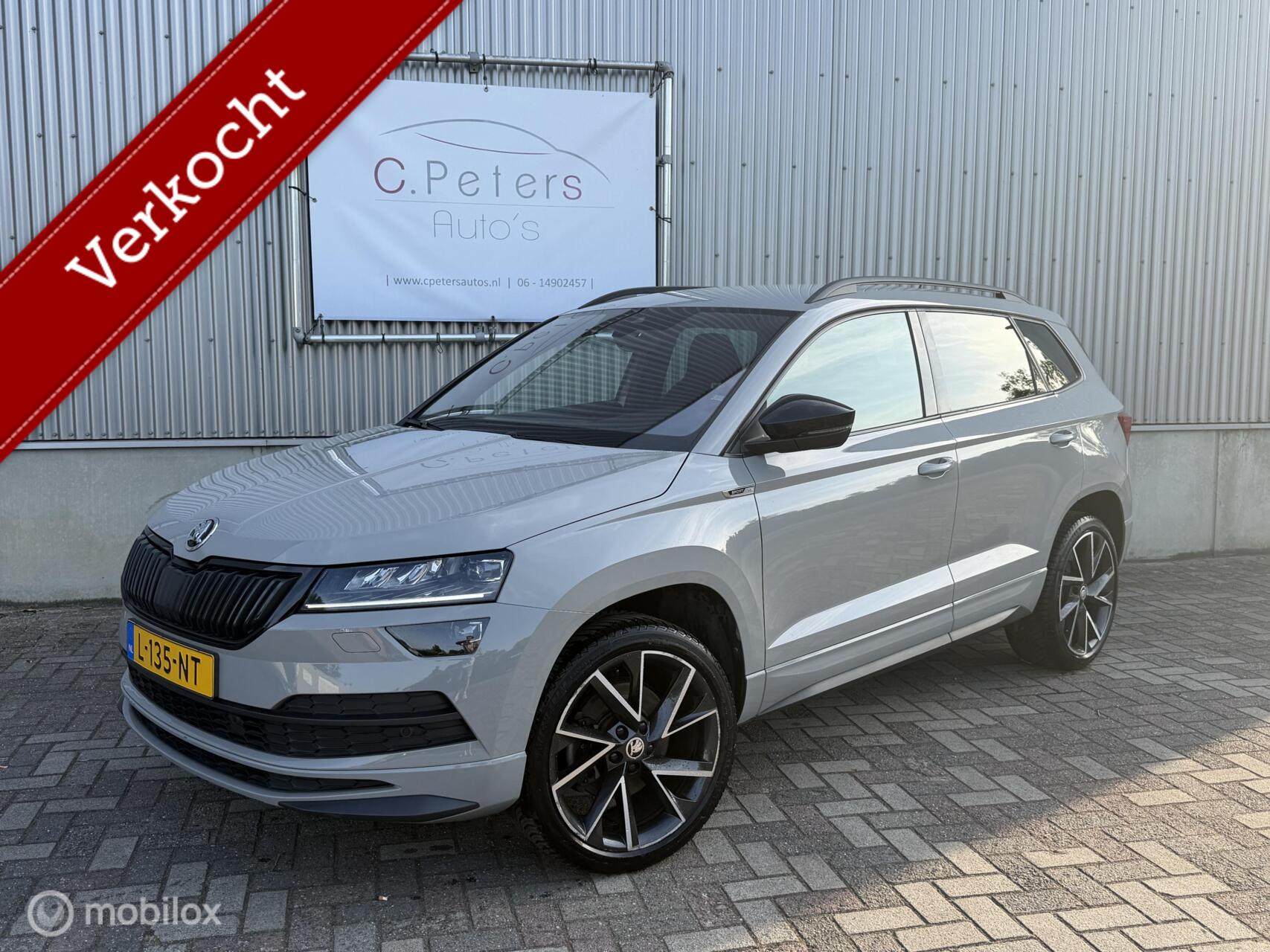 Skoda Karoq 1.5 TSI ACT Sportline Business 2021 / Virtual Cockpit / LED / Camera  / Trekhaak / 1e eigenaar NAP 2021 - voorkant