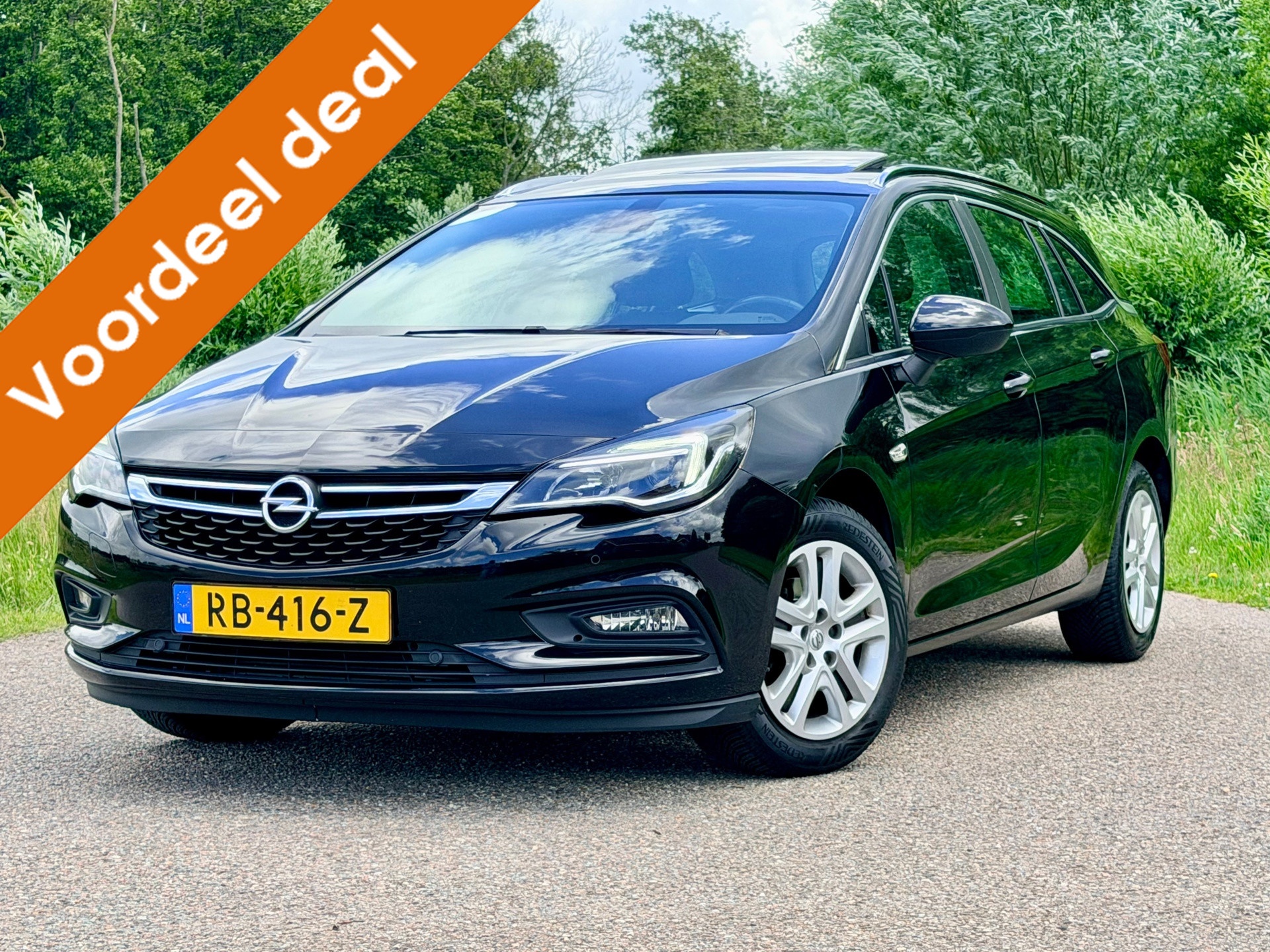 Opel Astra Sports Tourer 1.0 Business+ / Clima / Navi / Svhuifdak / CC / Verwarmde Stuur en Voorstoelen / PDC / 2de Eigenaar / NAP 2017 - voorkant