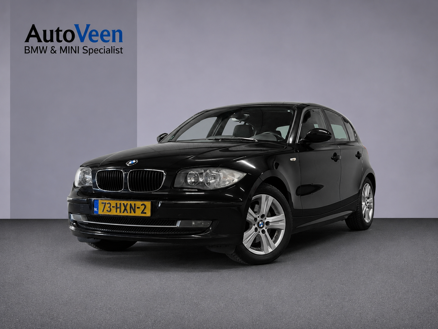 BMW 1er Reihe 118i Business Line (PARKEERSENSOREN, TREKHAAK, GOED ONDERHOUDEN) 2009 - voorkant