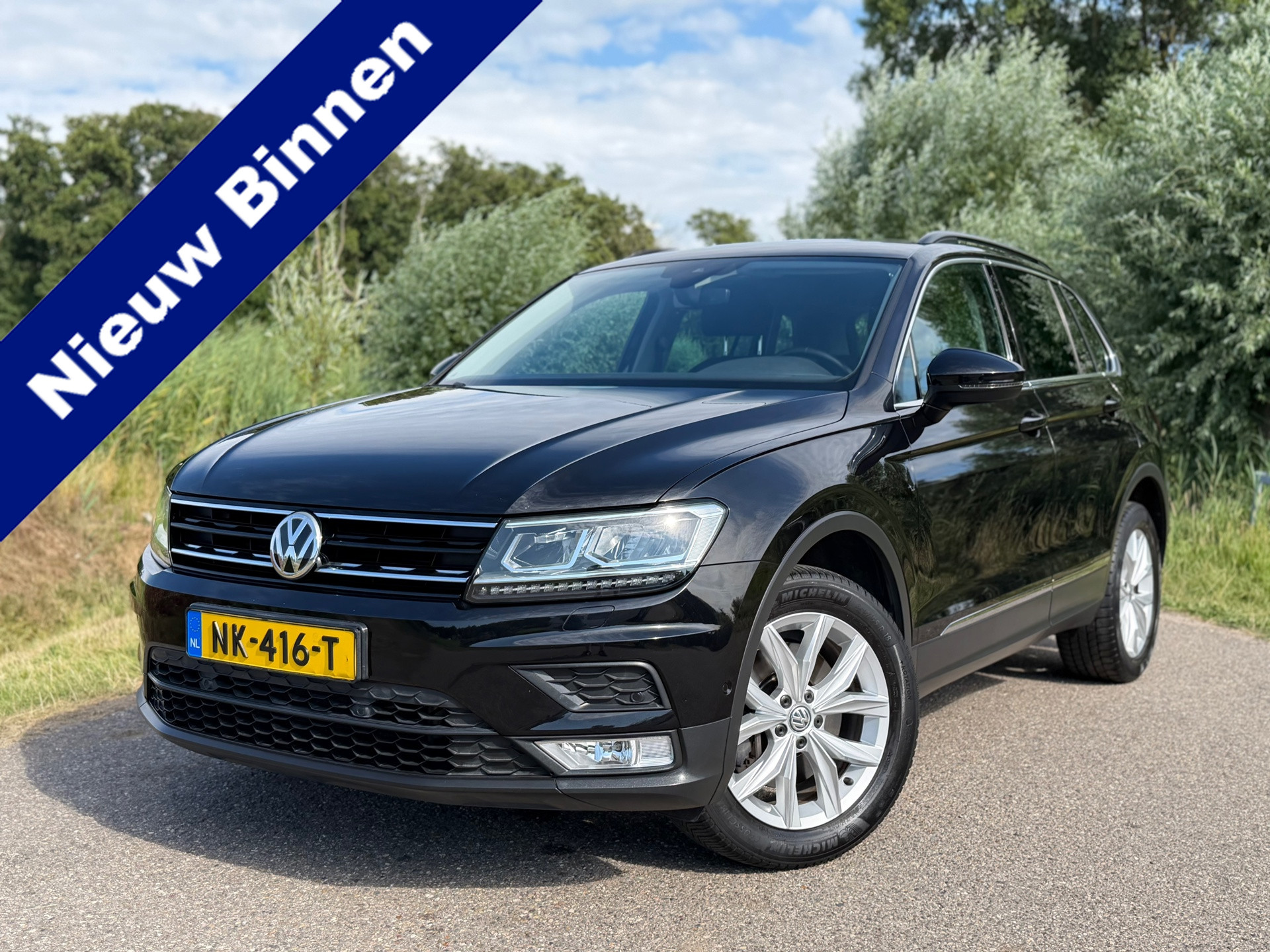 Volkswagen Tiguan 2.0 TSI 4Motion Highline / Perfect onderhouden / Automaat / Stoelverwarming / Navigatie / Camera / 18"LM Velgen 2016 - voorkant
