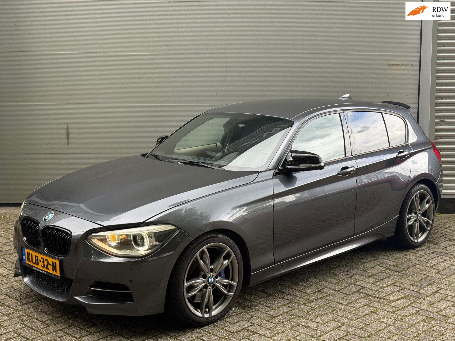 BMW 1-serie M135i xDrive l Xenon l Volleder l Navi l Cruise l Climate l APK 07-27 l 2013 - voorkant