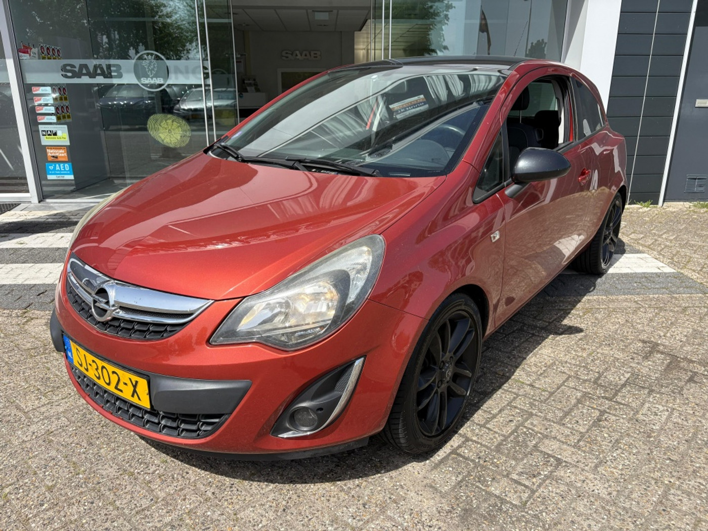 Opel Corsa 1.4-16V Cosmo 2012 - voorkant