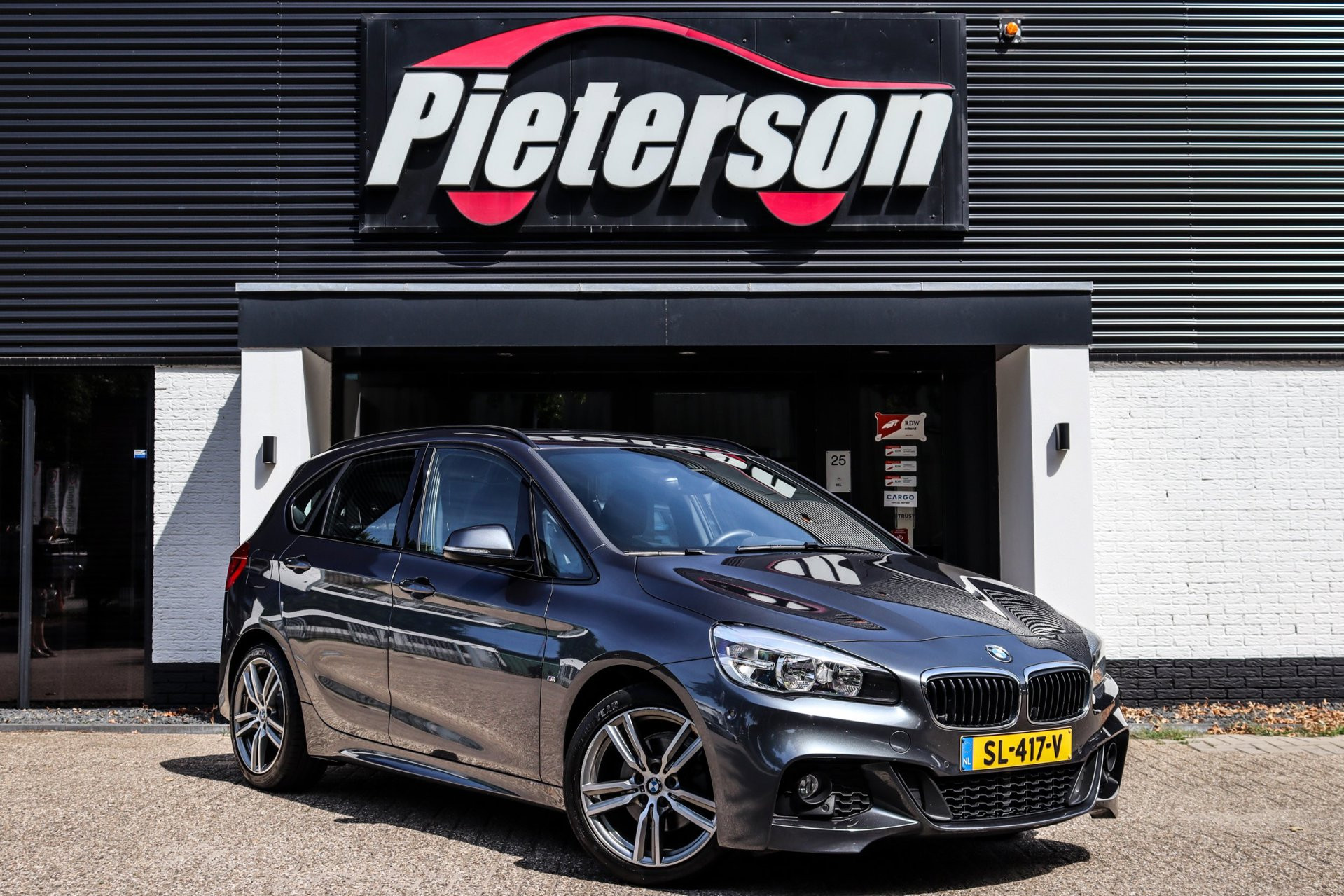 BMW 218i Active Tourer 218i M-Pakket DEALER OH TREKHAAK 2017 - voorkant