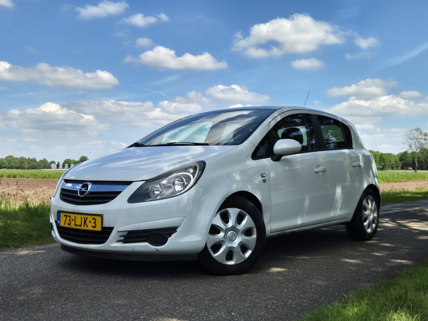 Opel Corsa 1.0-12V '111' Edition | Airco | Met APK 2010 - voorkant