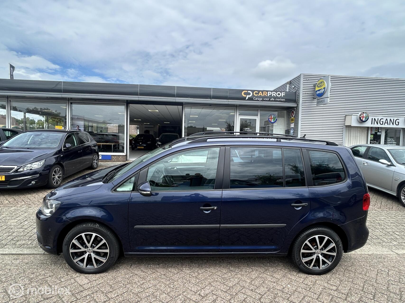 Volkswagen Touran 1.4 TSI Highl. 7p. Automaat Pano 2014 - voorkant