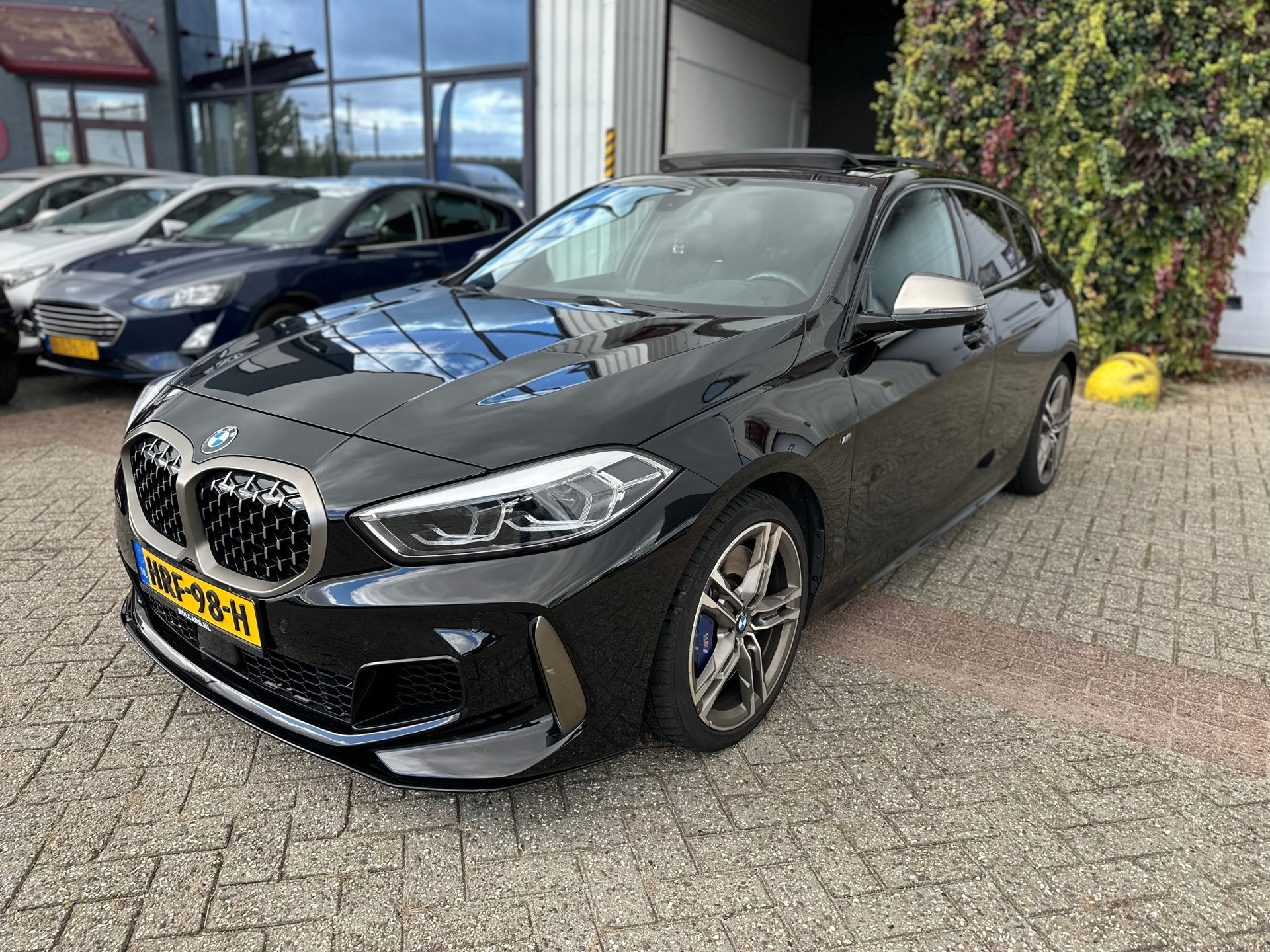 BMW M135i xDrive M135i xDrive High Executive,PANO,HUD,Camera 2019 - voorkant