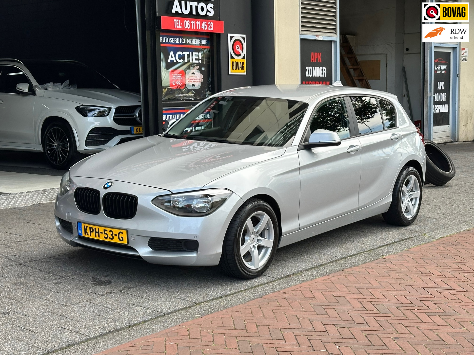 BMW 1er Reihe 116i Business Automaat Navi Clima PDC 2012 - voorkant