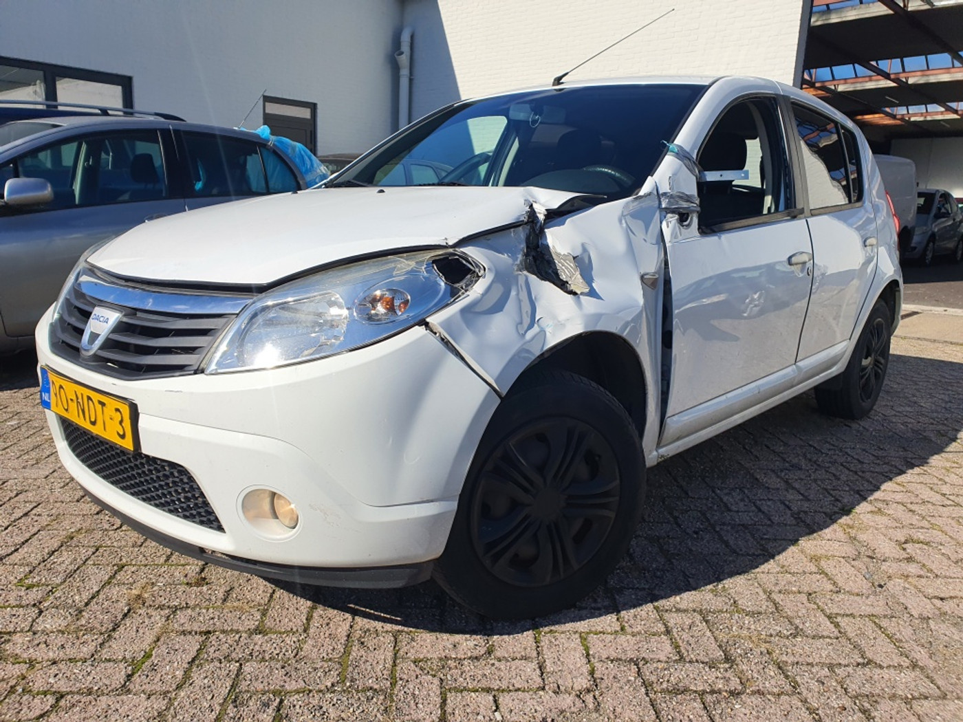 Dacia Sandero 1.2 Lauréate 5-DRS|AIRCO|SCHADE/EXPORT 2010 - voorkant