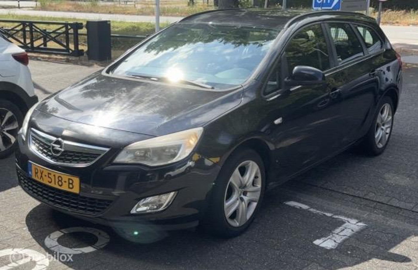 Opel Astra Sports Tourer 1.4 Cosmo 2011 - voorkant
