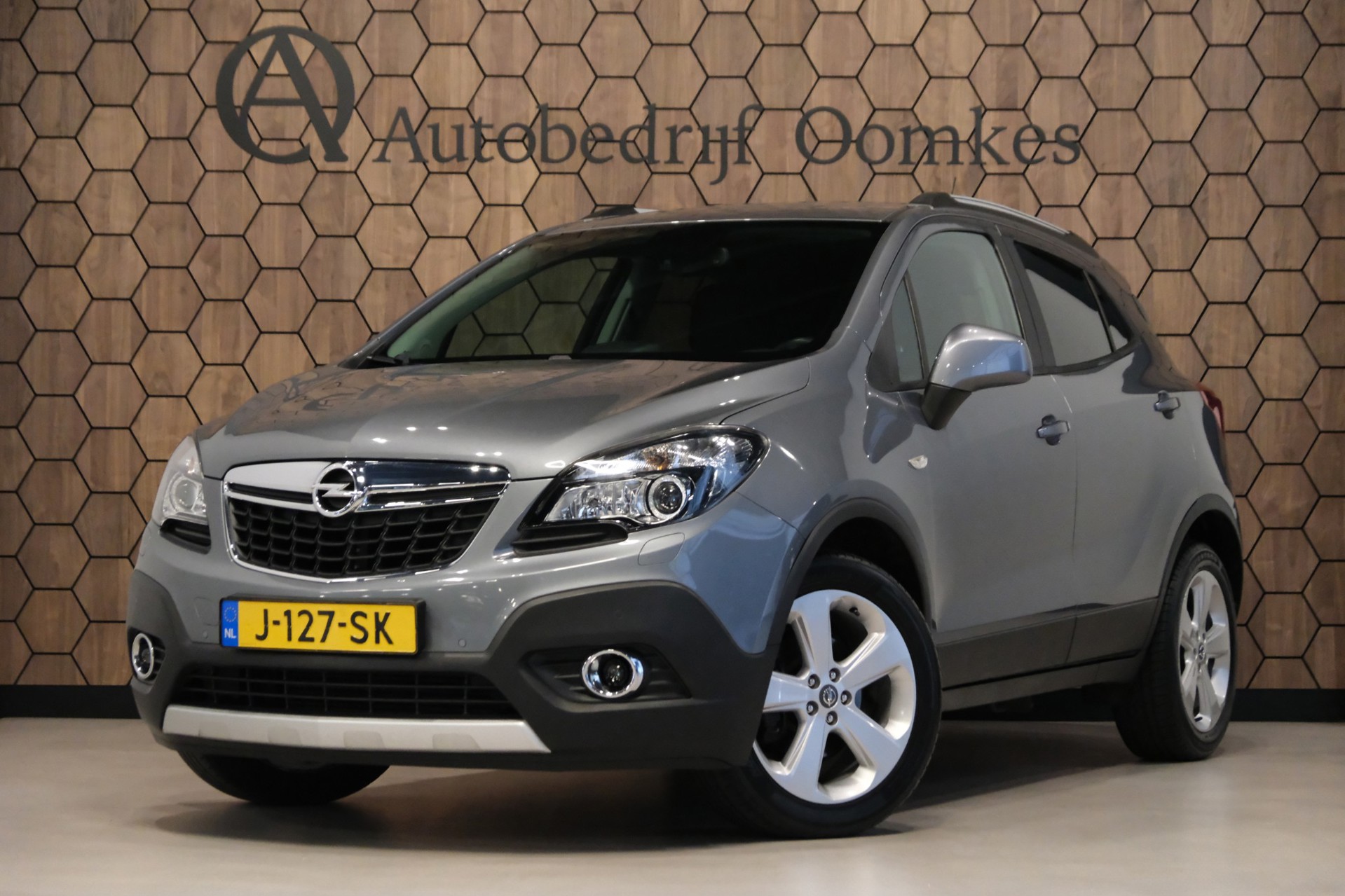 Opel Mokka 1.4 T Cosmo 4x4 *Navigatie + Trekhaak* 123dkm! Stoel+Stuurwielverwarming UNIEKE Auto 2014 - voorkant