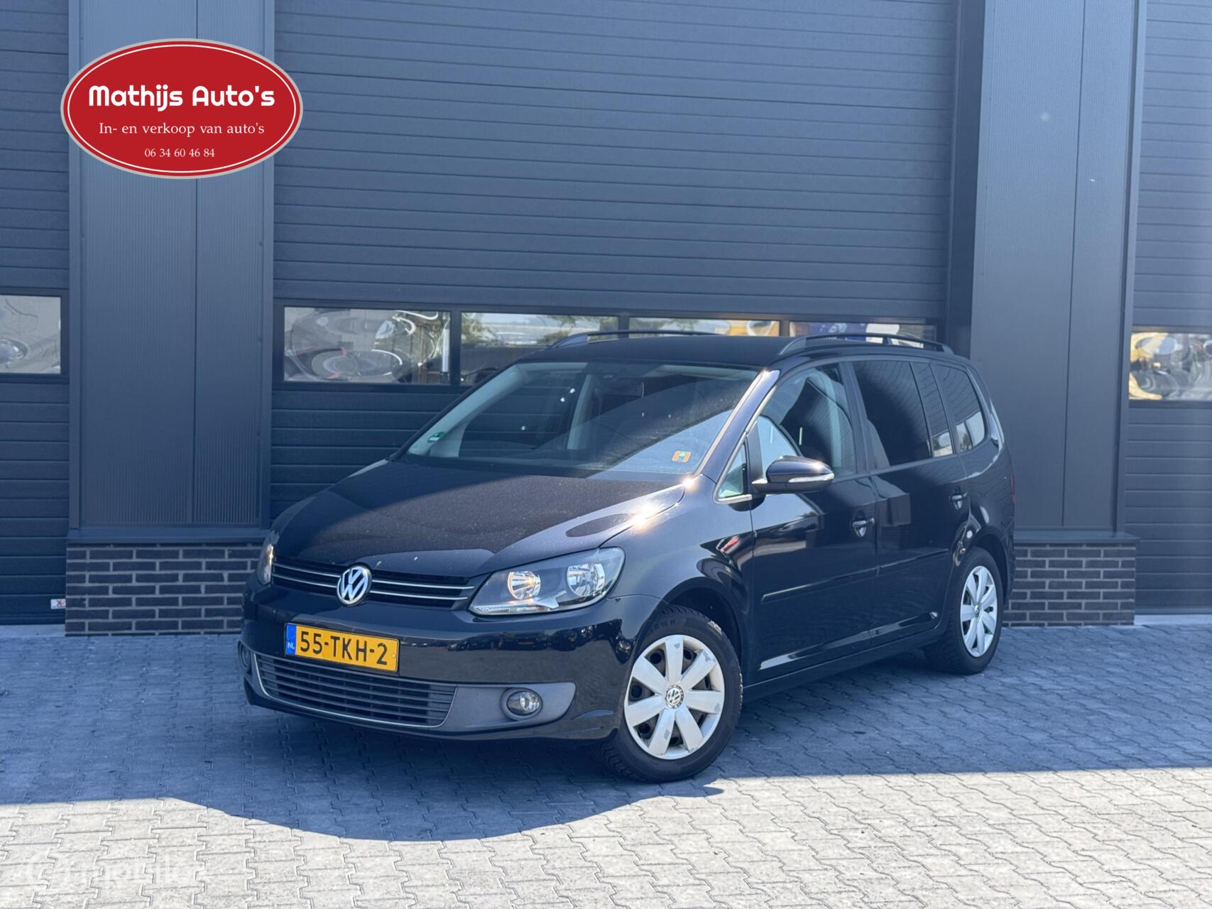 Volkswagen Touran 1.6 TDI Highline BlueMotion 2012 - voorkant