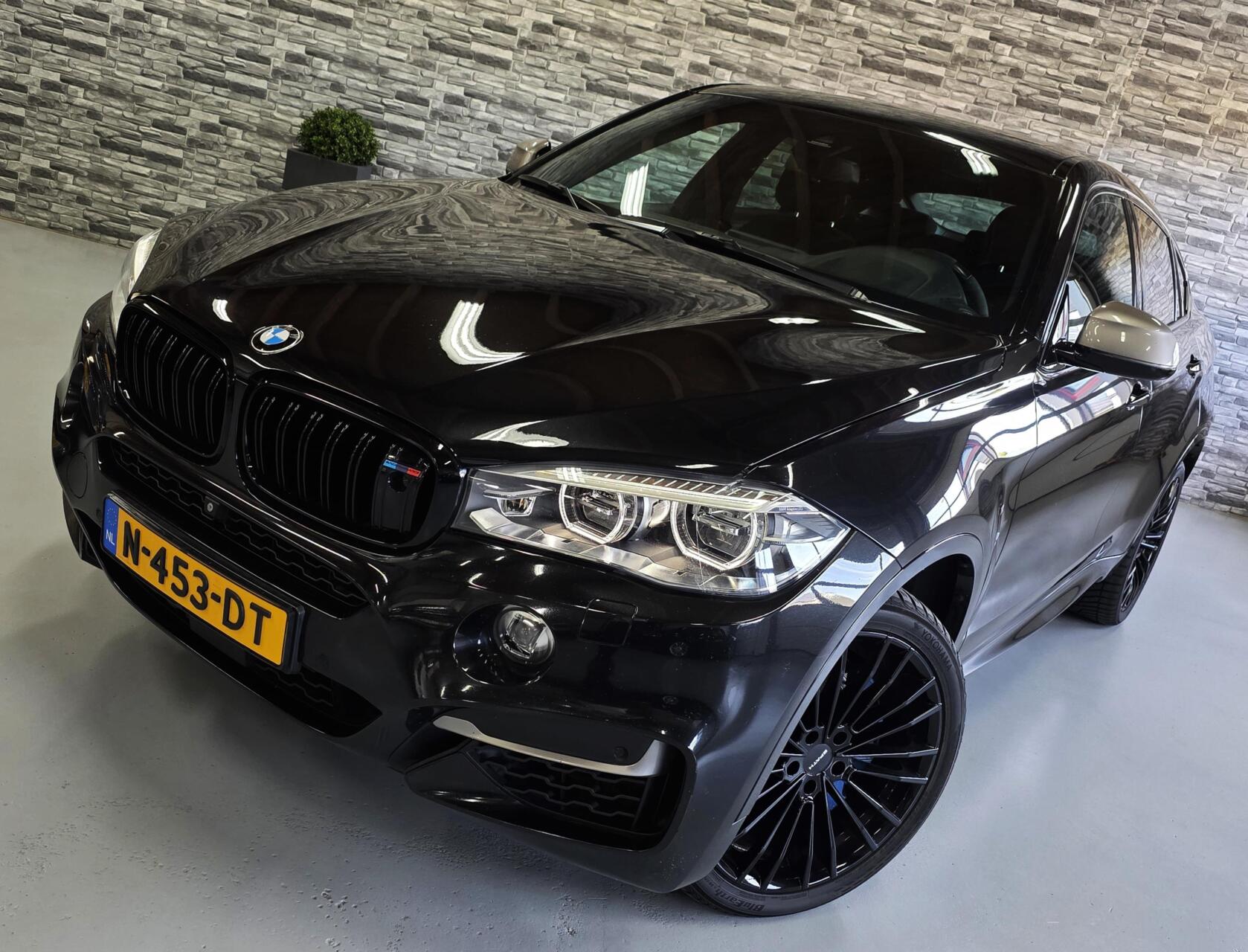 Foto van BMW X6 M50d
