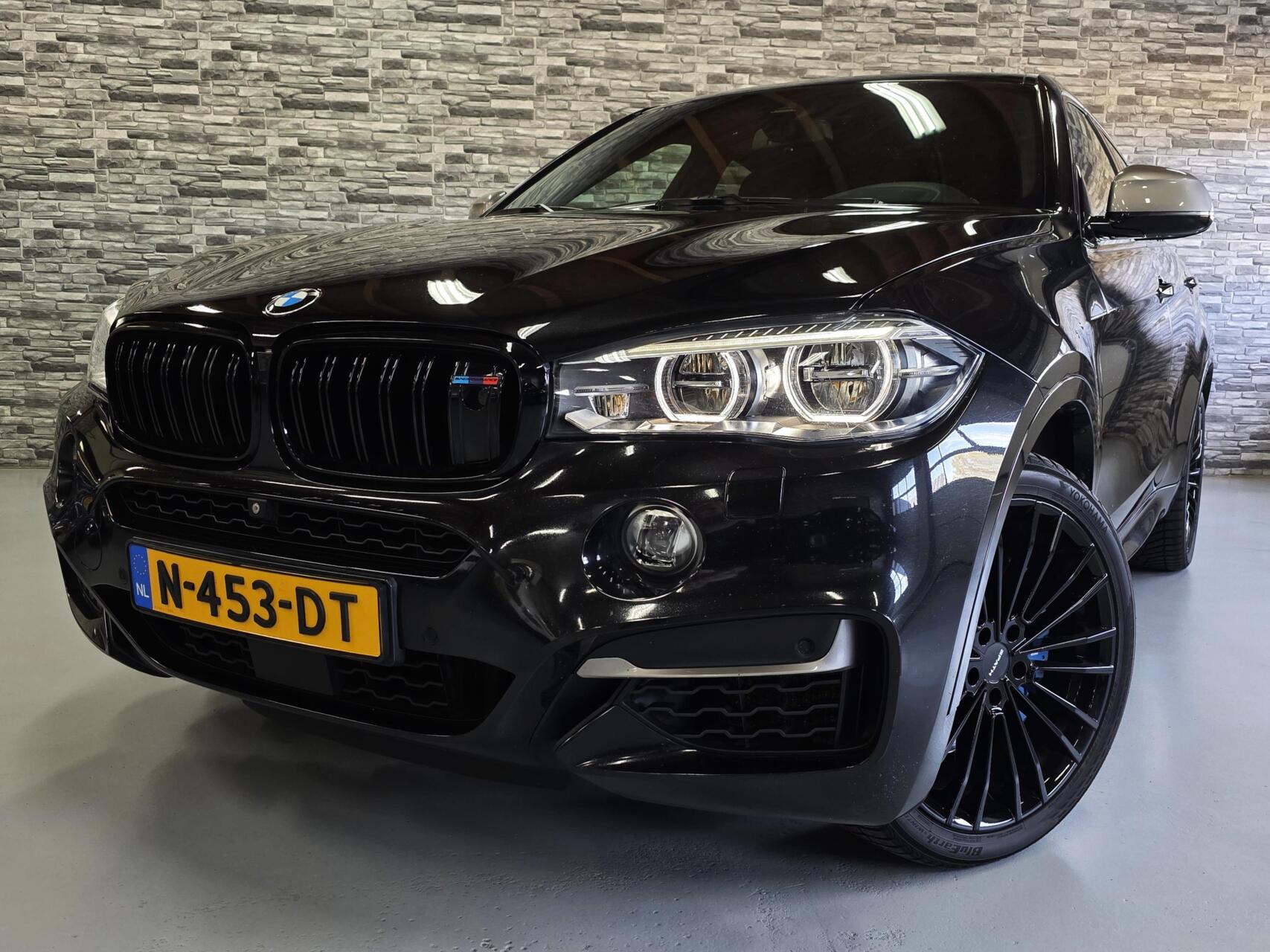 Foto van BMW X6 M50d