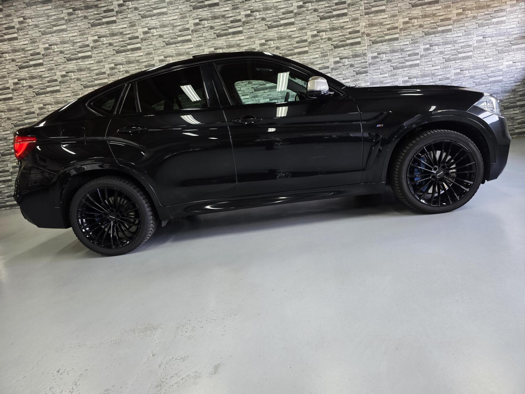 Foto van BMW X6 M50d