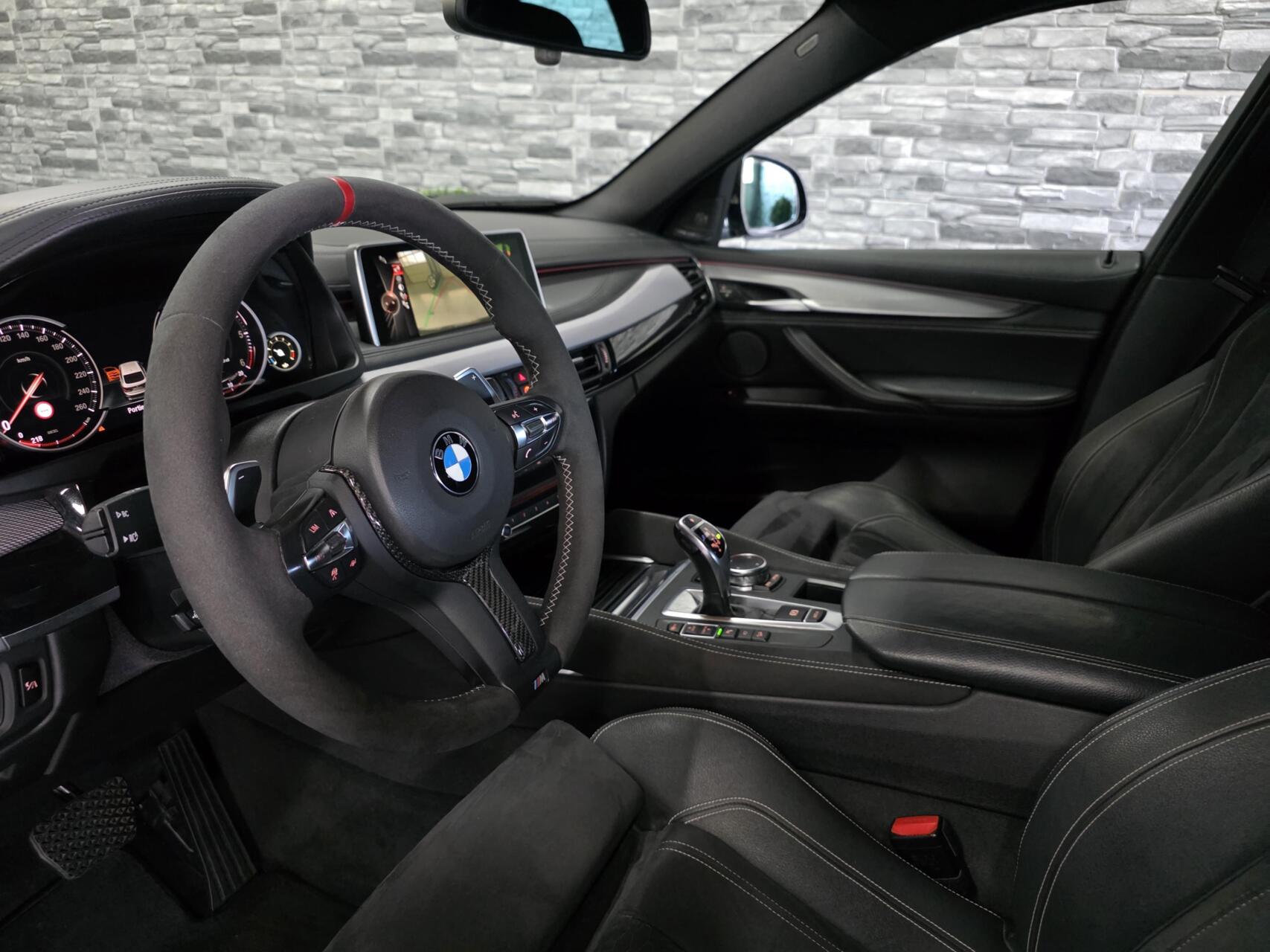 Foto van BMW X6 M50d