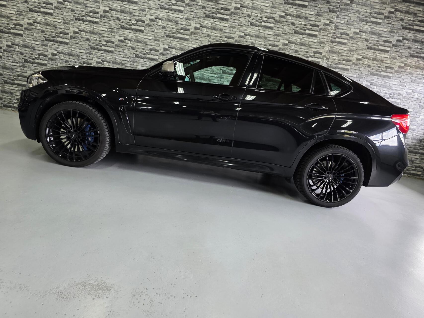 Foto van BMW X6 M50d
