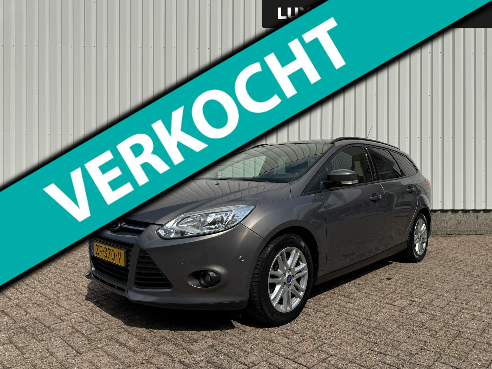 Ford Focus 1.6 EcoBoost Lease Titanium, Trekhaak 1.500kg, 4 seizoenenbanden, PDC 2013 - voorkant