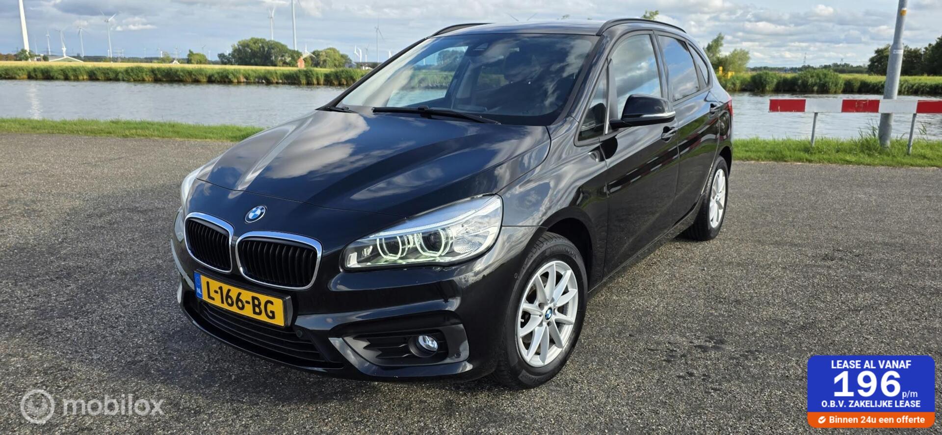 BMW 216i Active Tourer 216i High Executive, 97000km A 2017 - voorkant