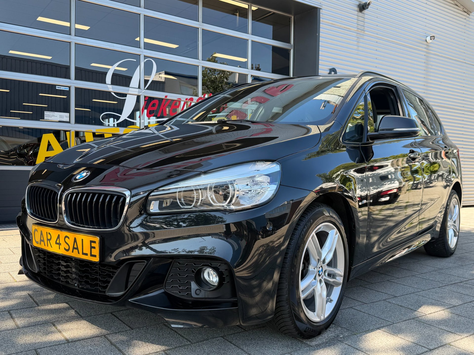 BMW 2-serie Active Tourer 218i M- Sport - Navigatie I Airco I Sport pakket I LED I PDC I Trekhaak I Dealer onderhouden 2021 - voorkant