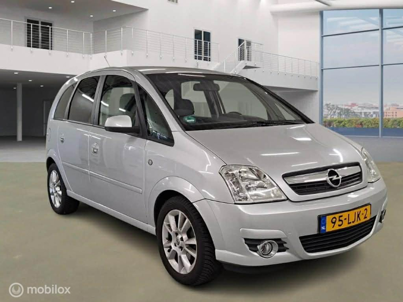 Opel Meriva-a 1.6-16V Cosmo AUTOMAAT 2010 - voorkant