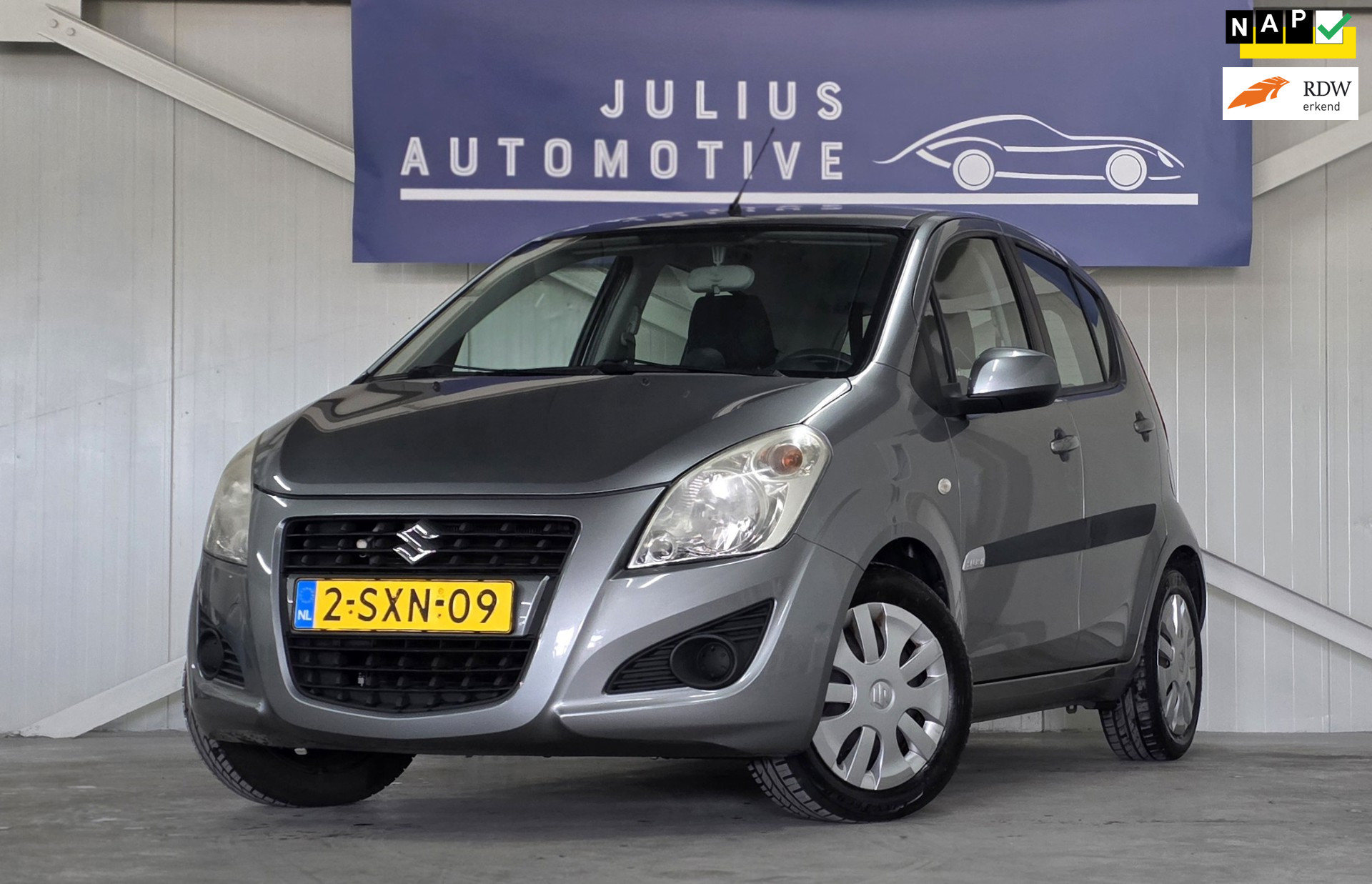 Suzuki Splash 1.0 VVT Comfort EASSS Airco Volledig Onderhoud Trekhaak Nieuwe APK Garantie Mooi! 2013 - voorkant
