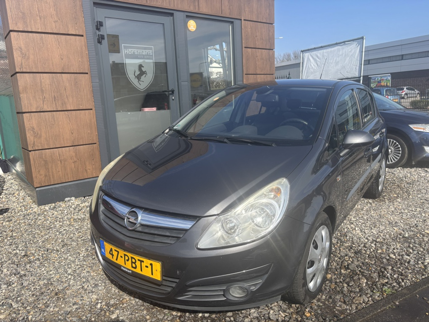 Opel Corsa 1.4-16V Cosmo 2011 - voorkant