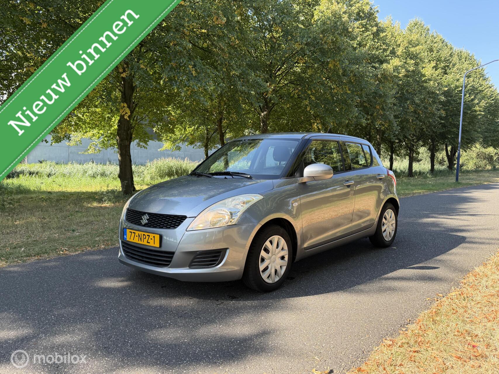 Suzuki Swift 1.2 Comfort*NEW APK 08/27*AIRCO*STOELVERWARMING 2010 - voorkant