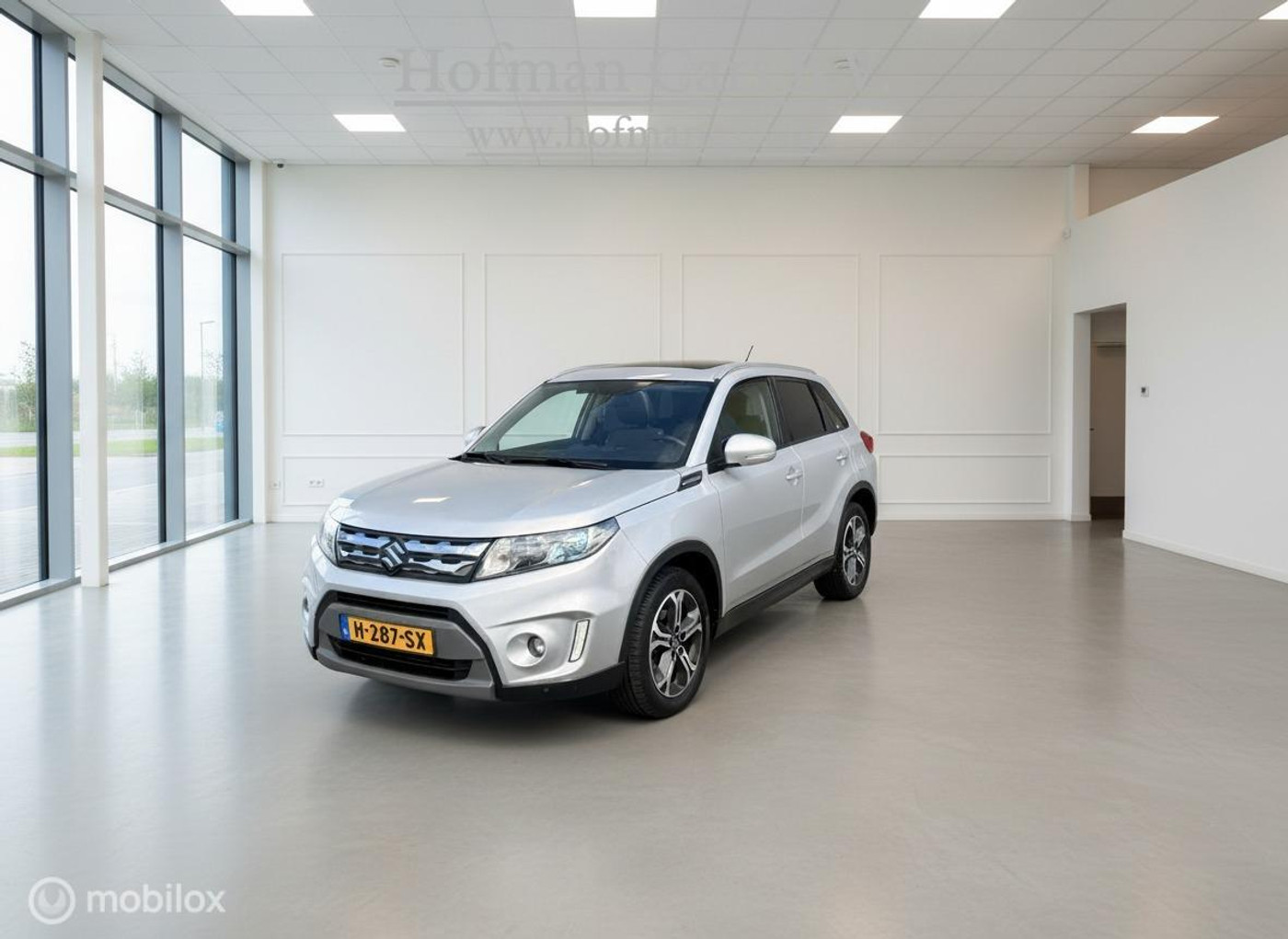 Suzuki Vitara 1.6 High Executive | Pano schuifdak | Trekhaak | Half Leder | Zeer compleet 2016 - voorkant