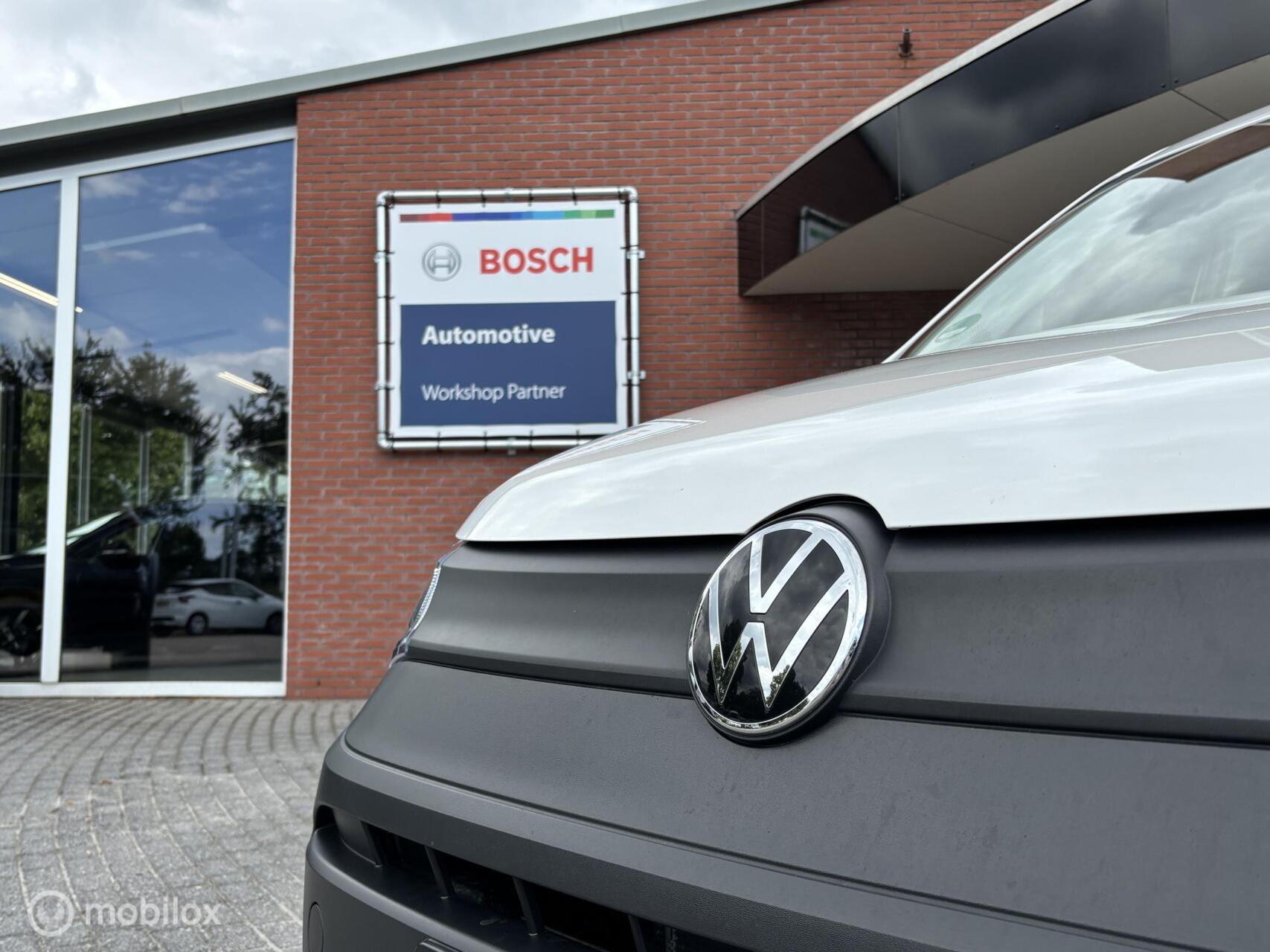 Foto van Volkswagen Caddy Modified Partition Wall