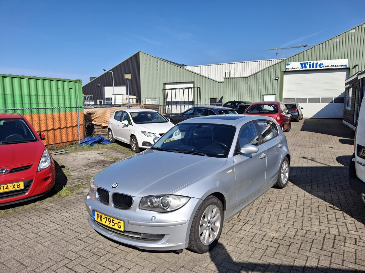BMW 1er Reihe 118i 2009 - voorkant