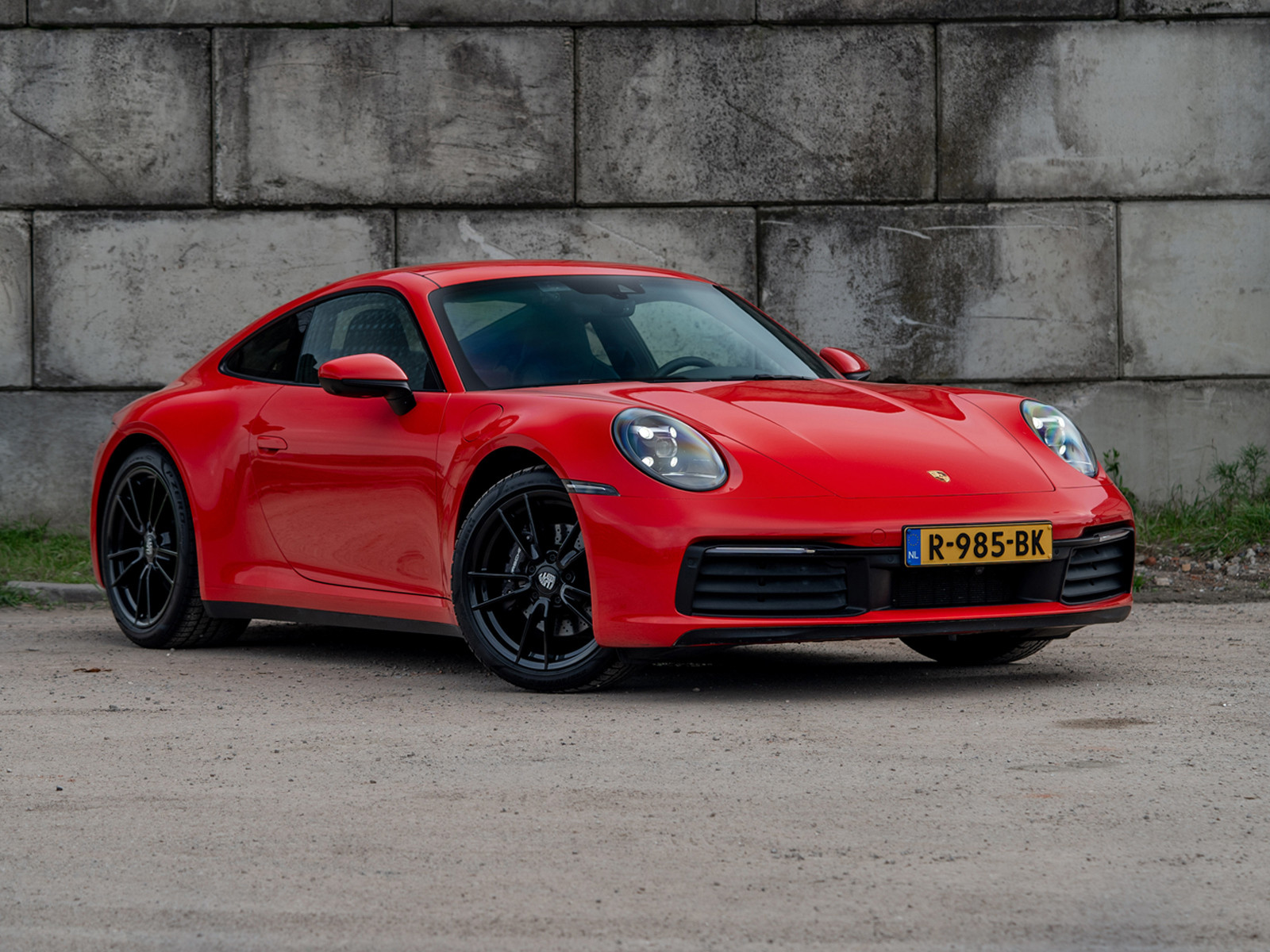 Porsche 911 Carrera Carrera 992 3.0 PDK 385PK (2020) | Sportuitlaat | Schuifdak | Sportstoelen | DealerOH | Compl. Historie | Indisch Rood 2020 - voorkant