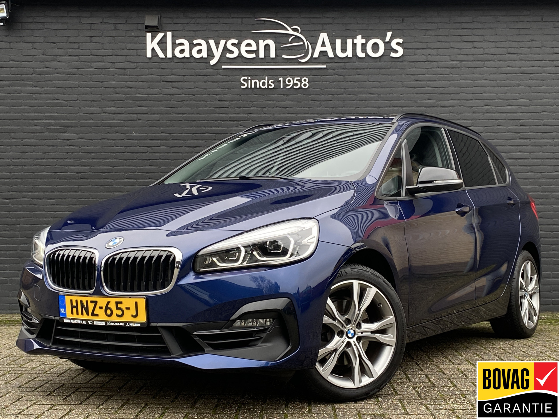 BMW 220i Active Tourer 220i High Executive Edition 192 pk M-sport AUT. | dealer onderhouden | navigatie | trekhaak | panoramadak 2020 - voorkant