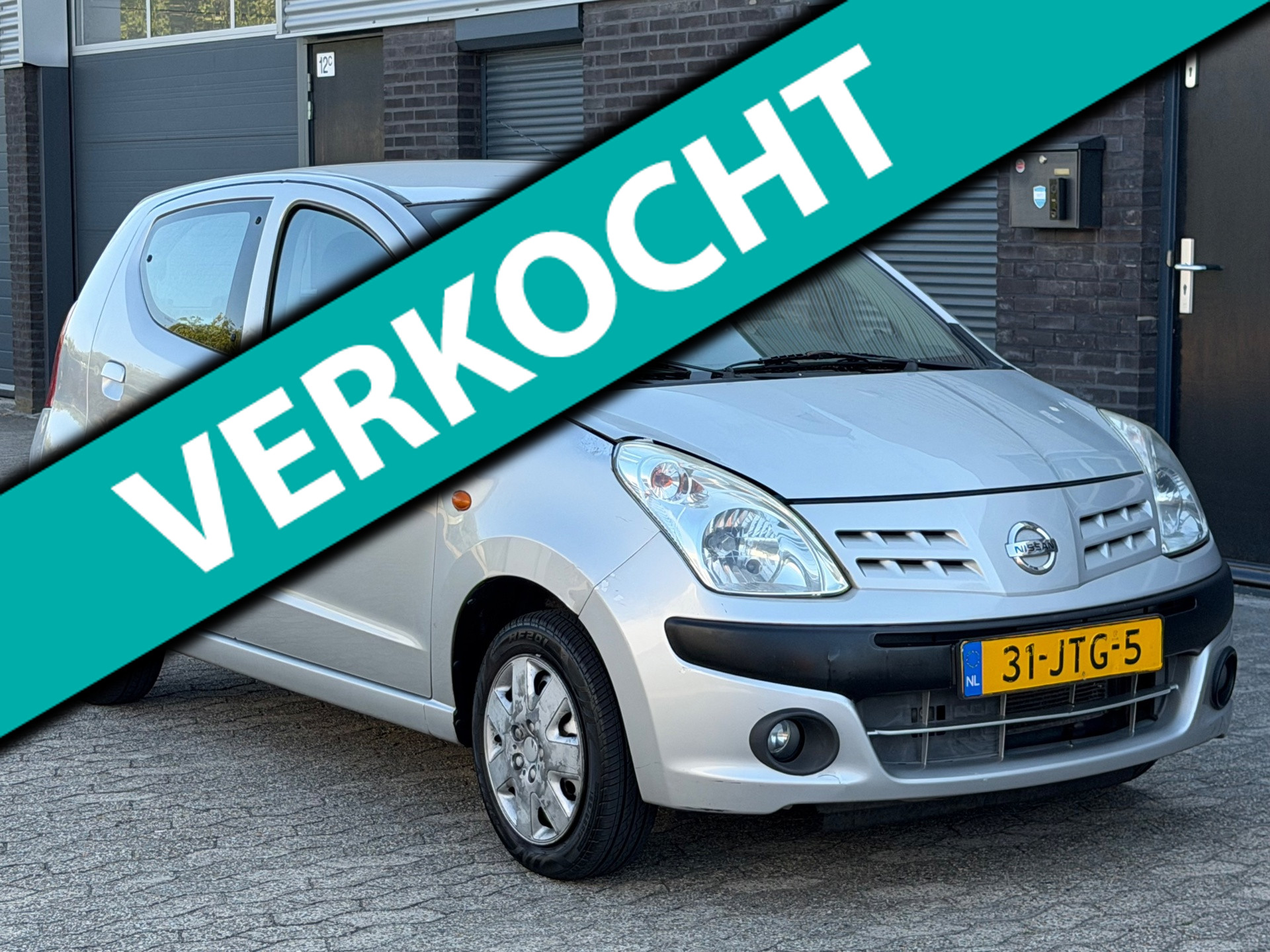 Nissan Pixo 1.0 Acenta AIRCO APK LEES TEKST 2009 - voorkant