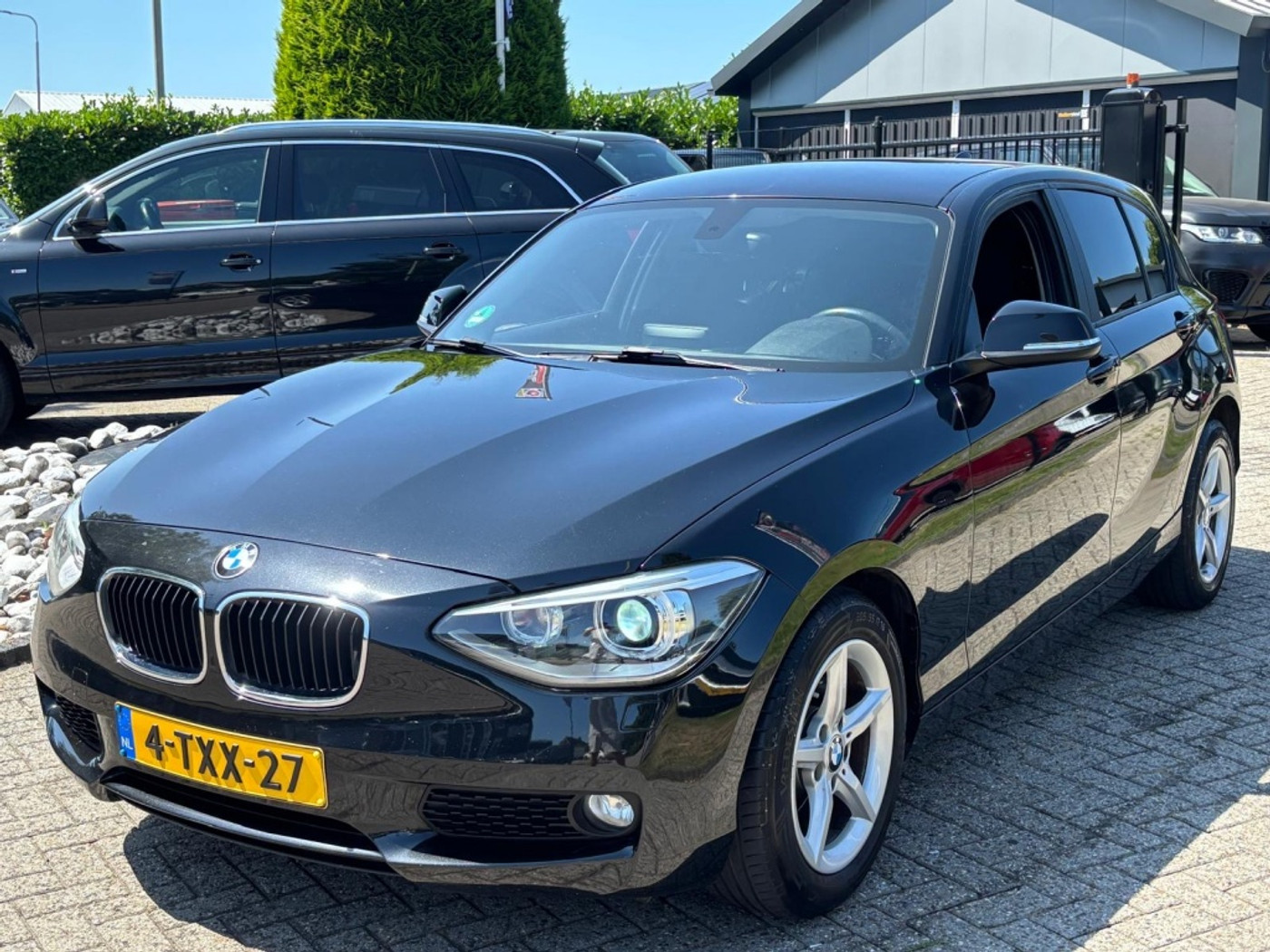 BMW 116i 116i Exe Automaat 2014 Zwart 5-Deurs NL Auto 2014 - voorkant
