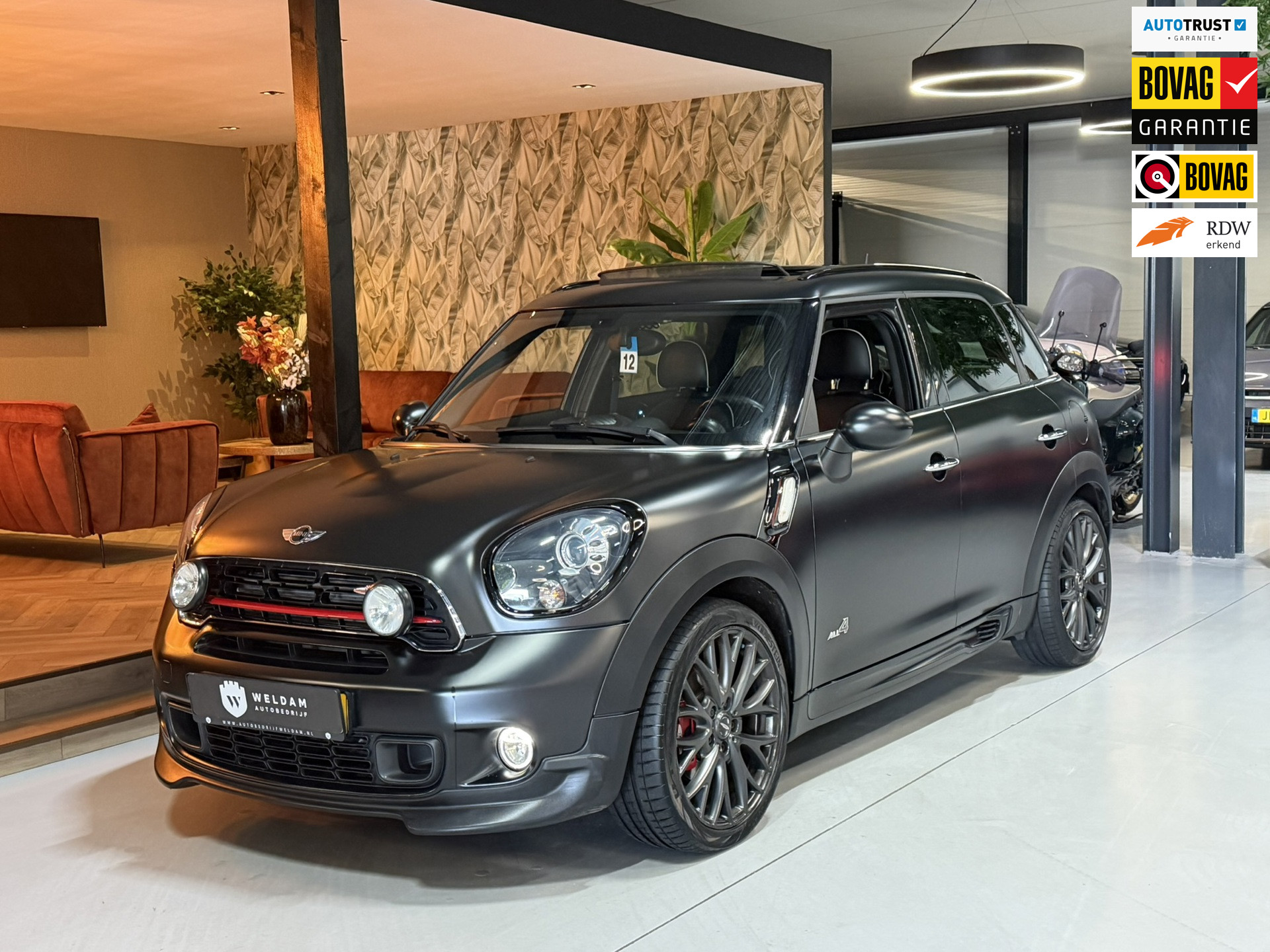 Mini John Cooper Works 1.6 John Cooper Works ALL4 Chili Garantie Nieuwe Ketting Pano Leder HarmanKardon StoelVW Cruise Navi Rijklaar 2015 - voorkant