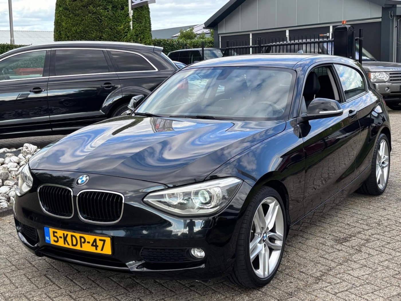 BMW 1er Reihe 116i Sport Upgrade Edition 2013 Zwart NL Auto Xenon 2013 - voorkant